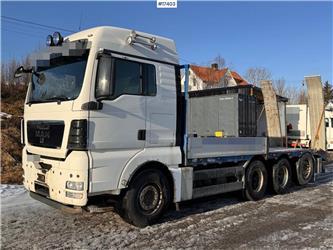 MAN TGX 35.480 8x4 flatbed truck w/ driving bridges