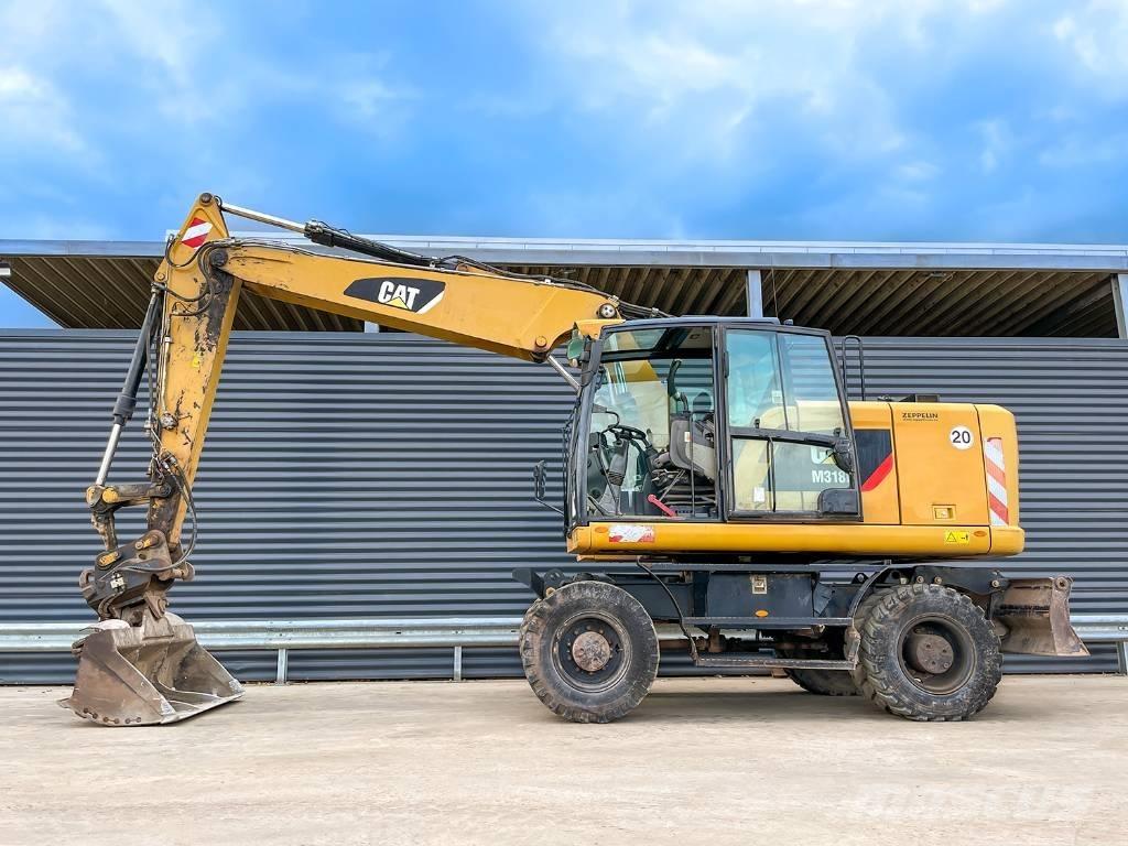 CAT M318F Hjulgravere