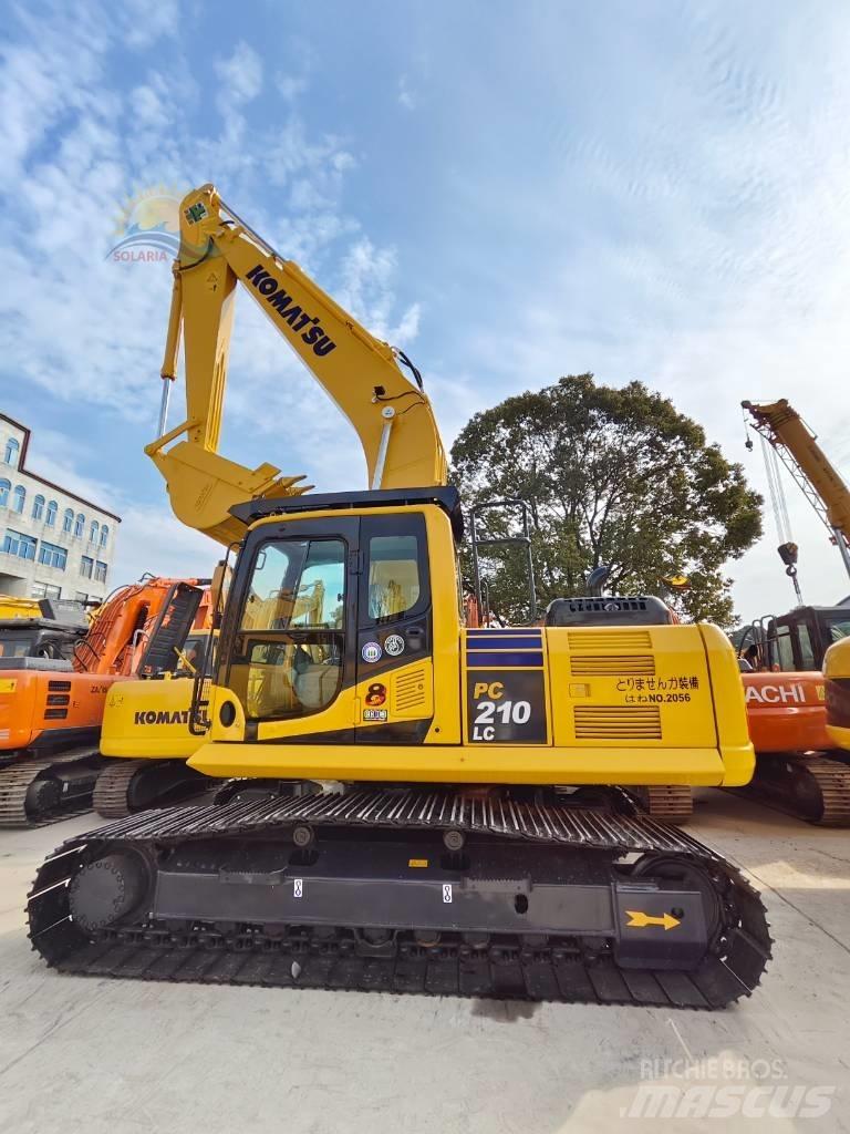 Komatsu PC 210 LC Beltegraver