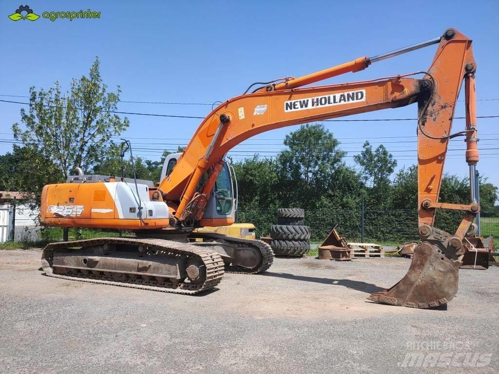 New Holland E 265 Beltegraver