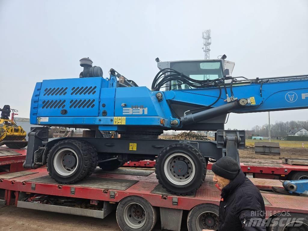 Fuchs MHL 331 Gravemaskiner for avfallshåndtering