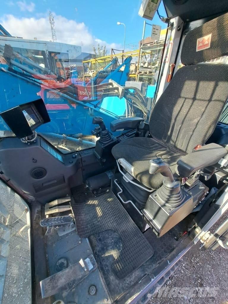 Fuchs MHL 320 Gravemaskiner for avfallshåndtering