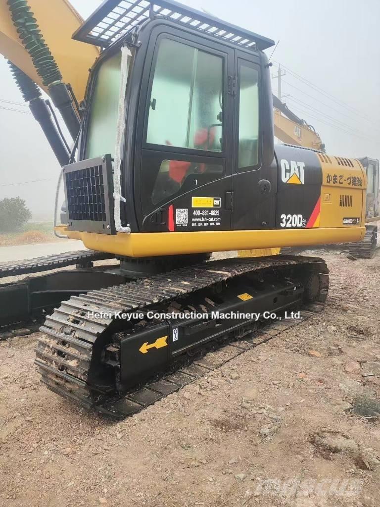 CAT 323 Beltegraver