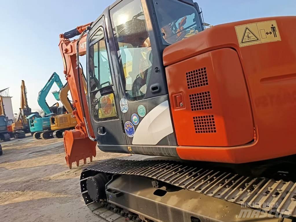 Hitachi ZX135 Beltegraver