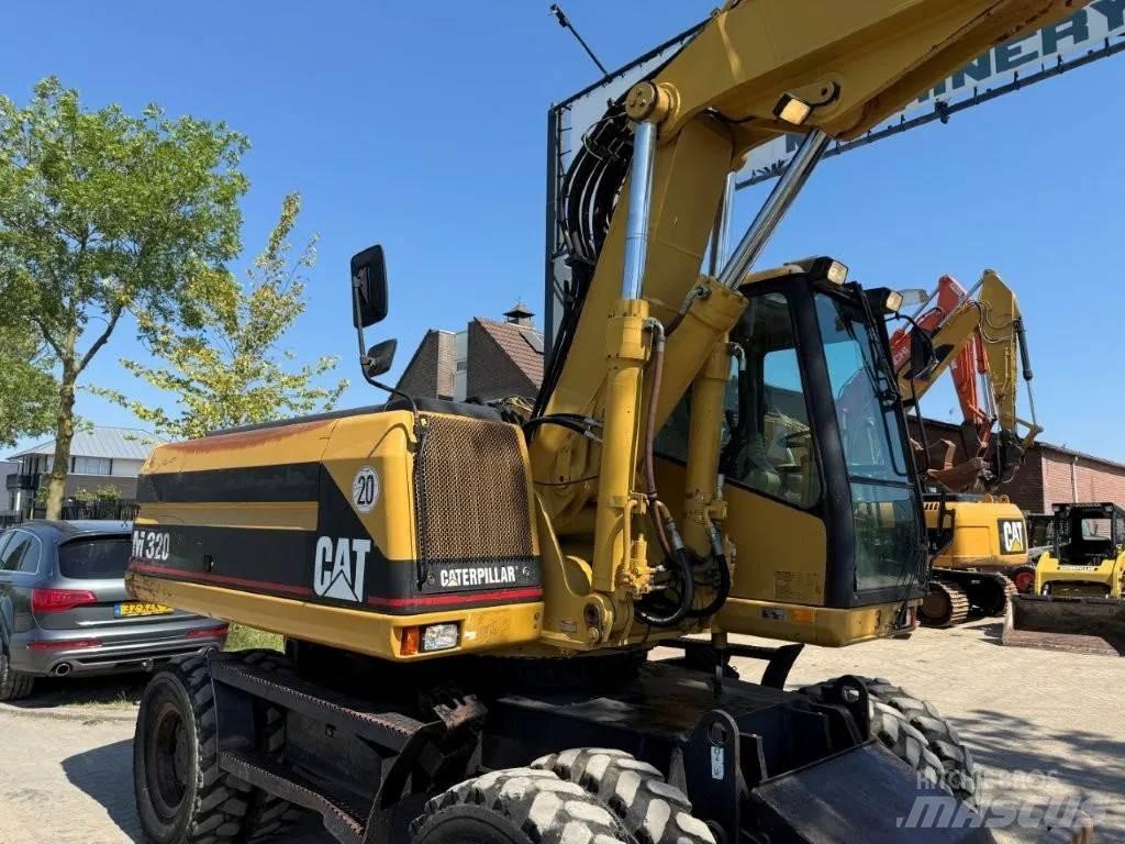 CAT M320 2001 Hjulgravere