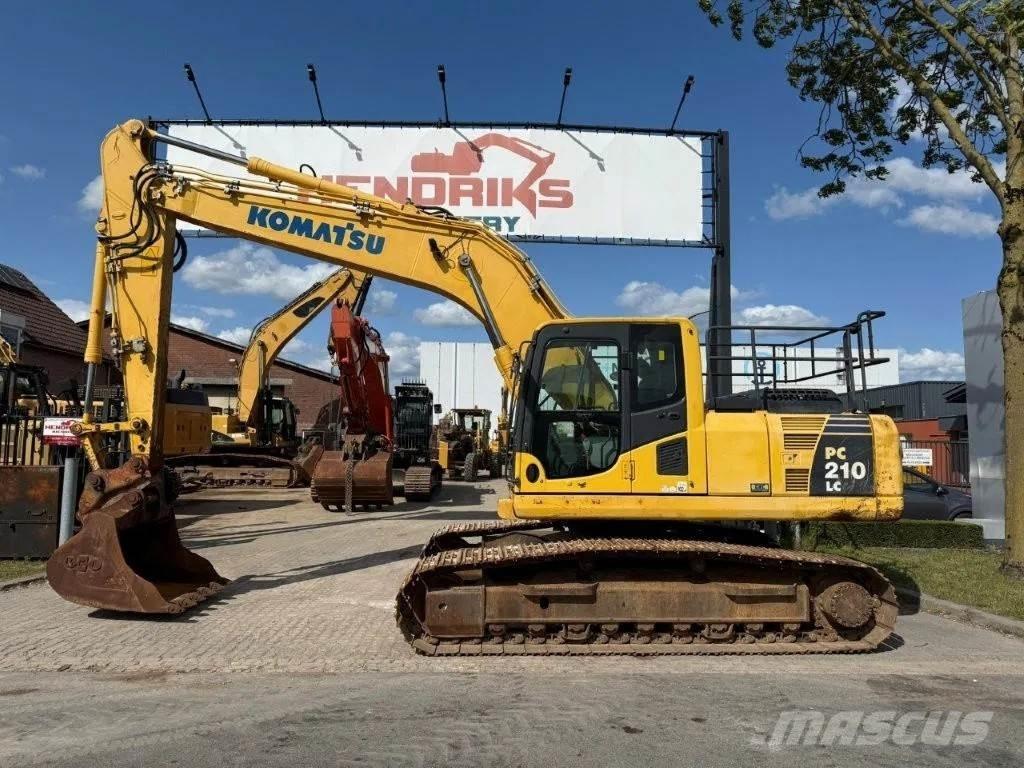 Komatsu PC210LC-8 Beltegraver