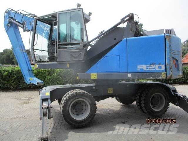Fuchs MHL 320 Gravemaskiner for avfallshåndtering