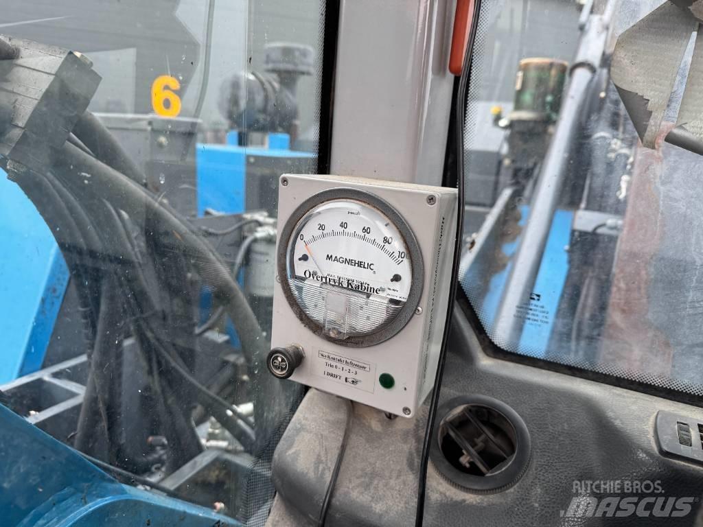 Fuchs MHL 320 Gravemaskiner for avfallshåndtering