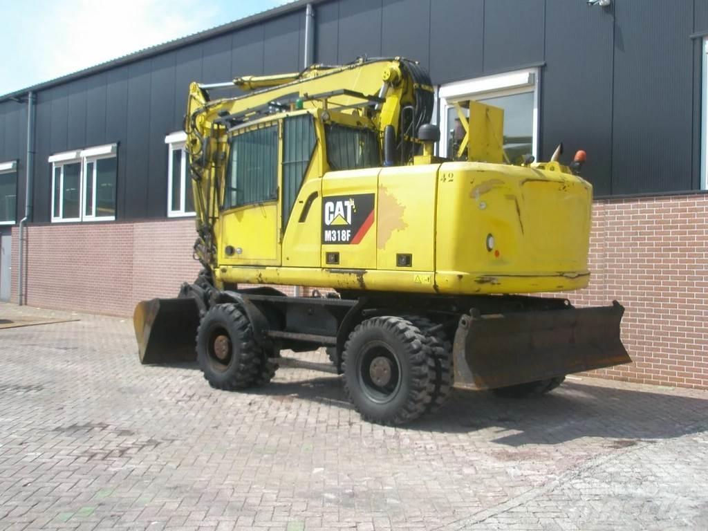 CAT M318F Hjulgravere