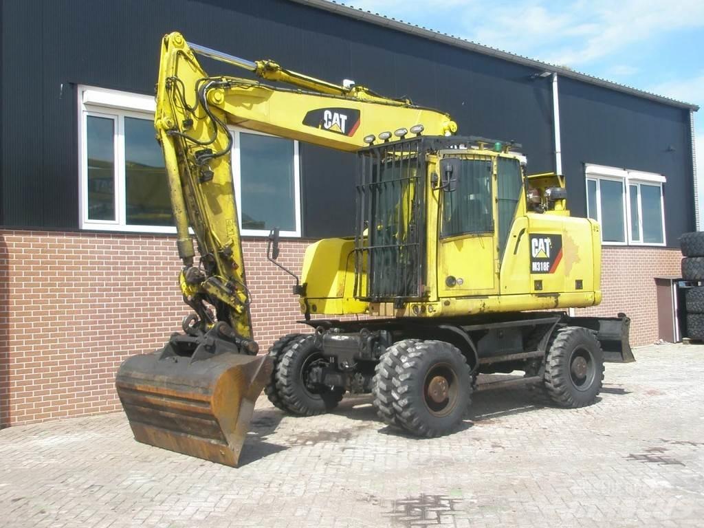 CAT M318F Hjulgravere