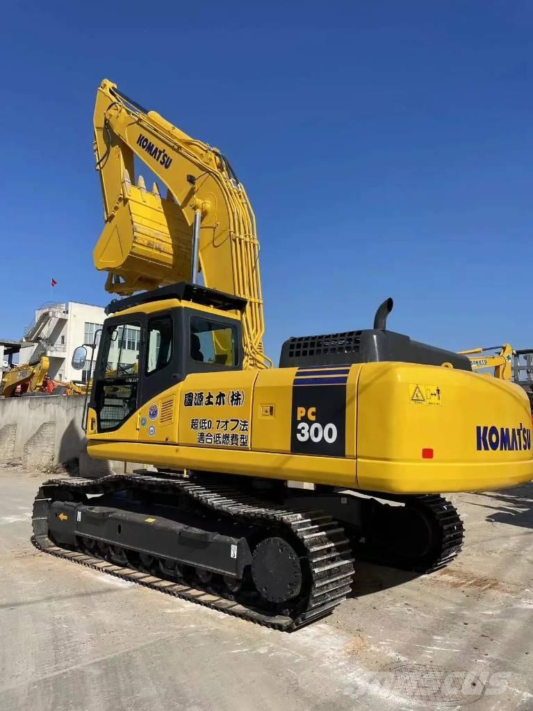 Komatsu PC300-7 Beltegraver