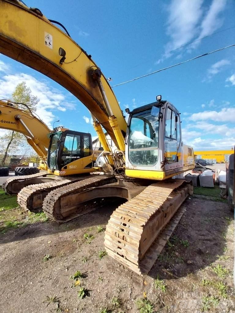 New Holland E 305 Beltegraver