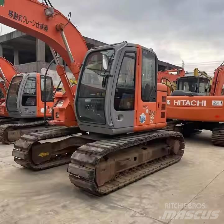 Hitachi ZX135US Beltegraver