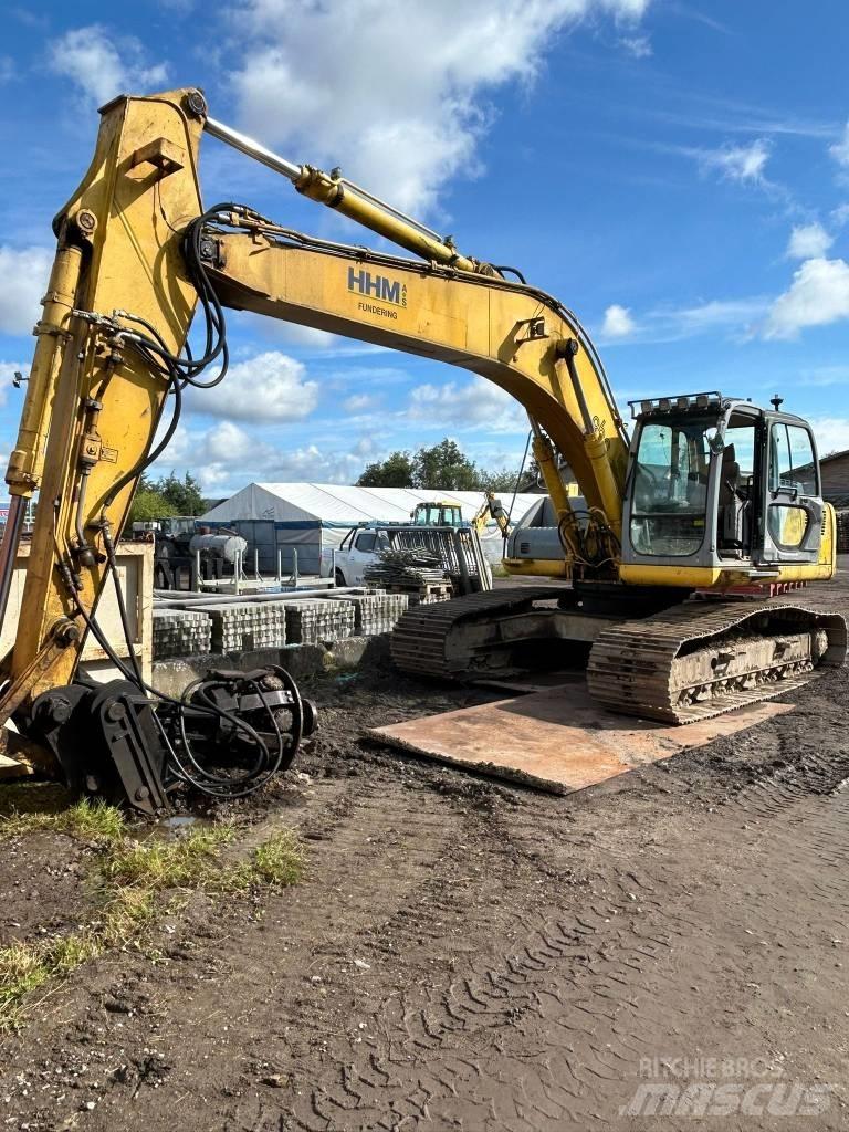 New Holland E 265 Beltegraver