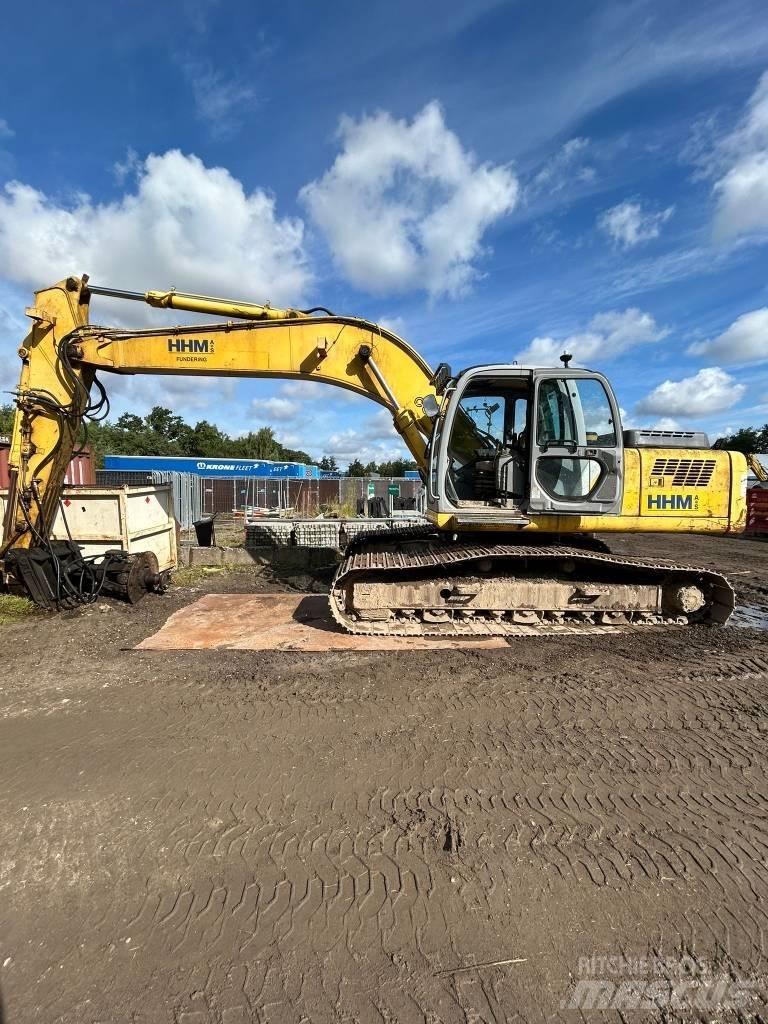 New Holland E 265 Beltegraver