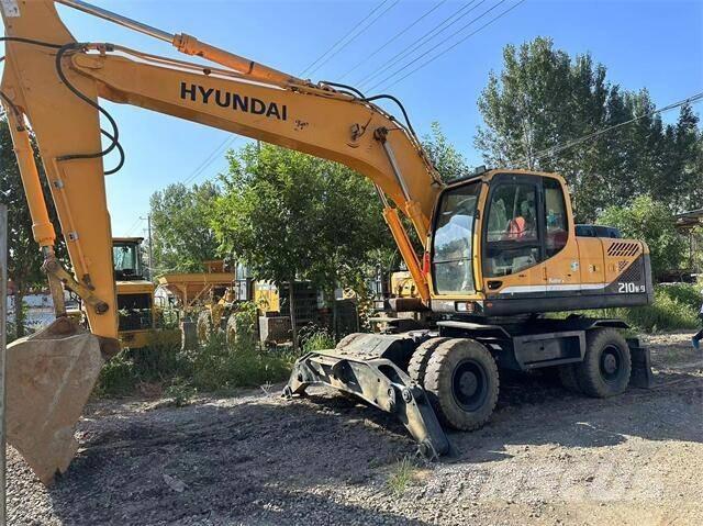 Hyundai 210W Beltegraver
