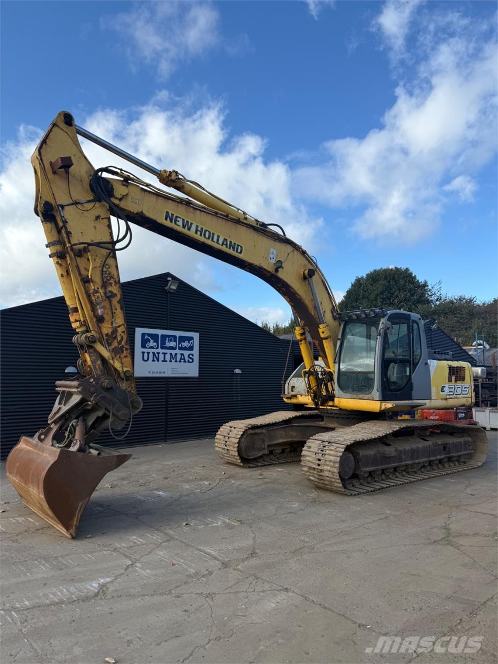 New Holland E305 Beltegraver