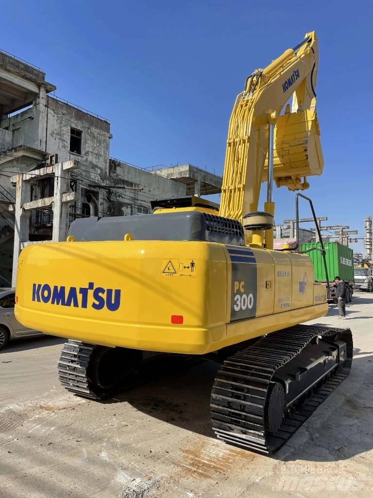 Komatsu PC300-7 Beltegraver
