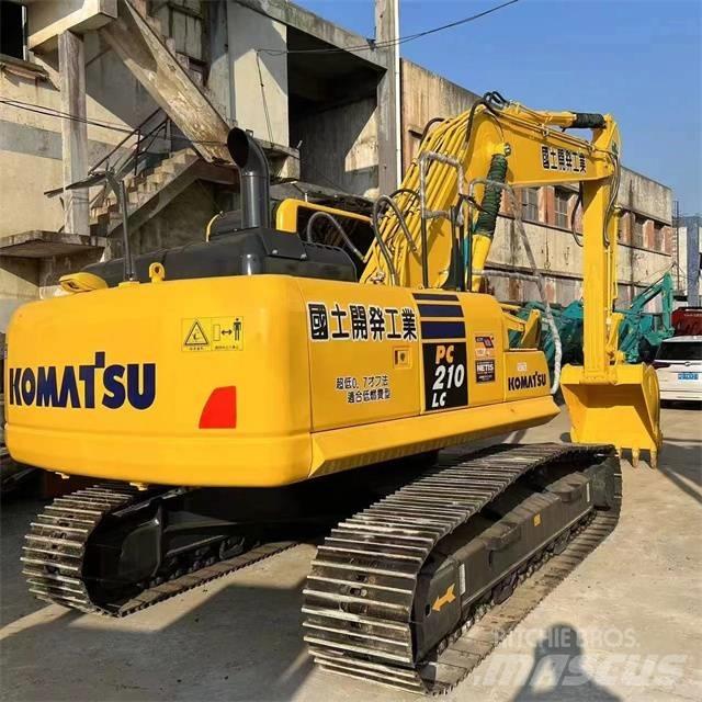 Komatsu PC 210 Beltegraver