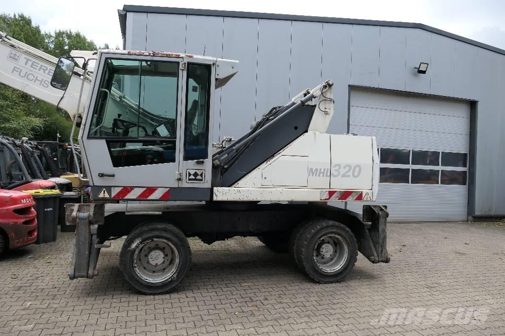 Fuchs MHL 320 Gravemaskiner for avfallshåndtering