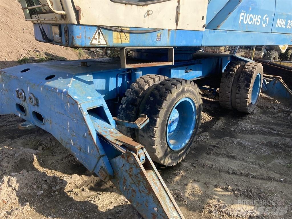 Fuchs MHL 331 Gravemaskiner for avfallshåndtering
