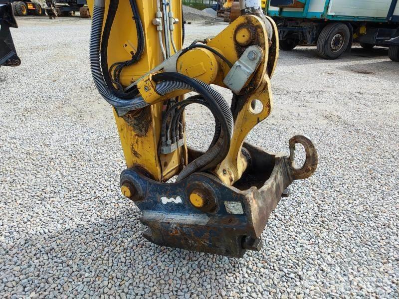 CAT MH3024 Gravemaskiner for avfallshåndtering