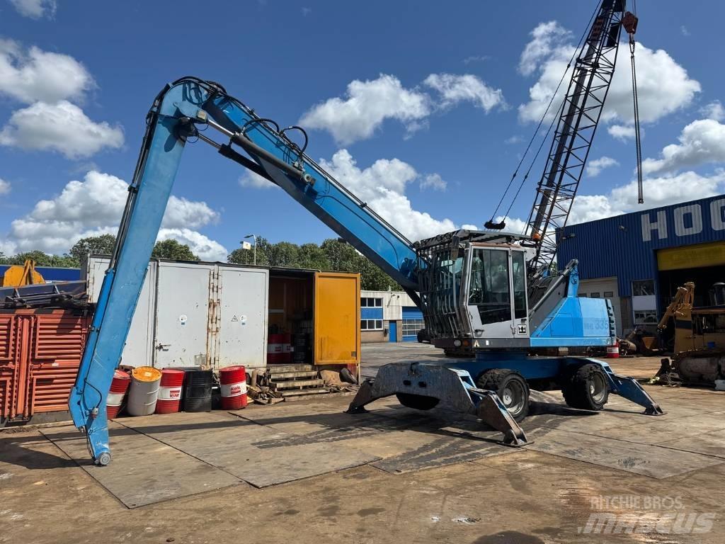 Fuchs MHL 335 Gravemaskiner for avfallshåndtering
