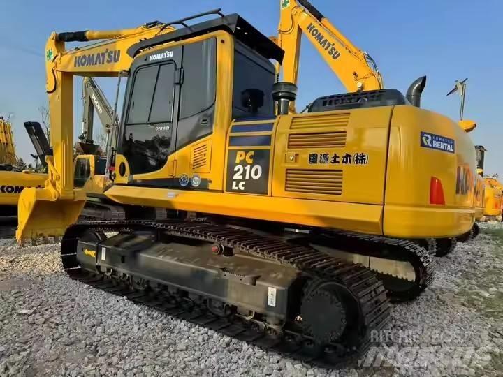 Komatsu PC210lc Beltegraver