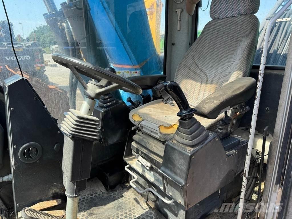 Fuchs MHL 320 Gravemaskiner for avfallshåndtering