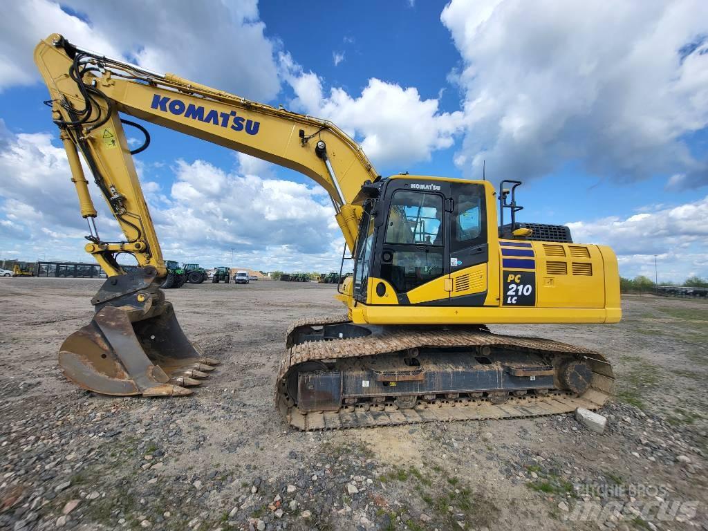 Komatsu PC210-11E0 Beltegraver