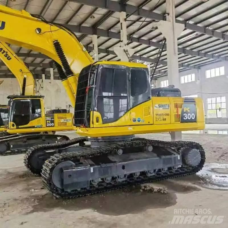 Komatsu PC300-7 Beltegraver