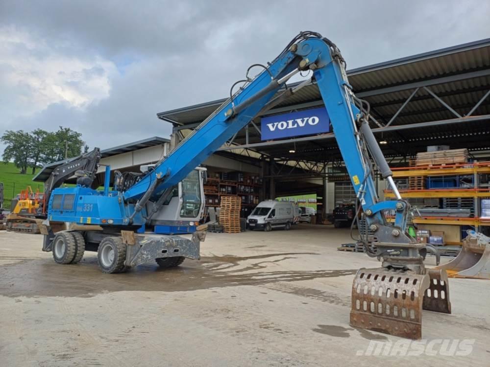 Fuchs MHL 331 Gravemaskiner for avfallshåndtering