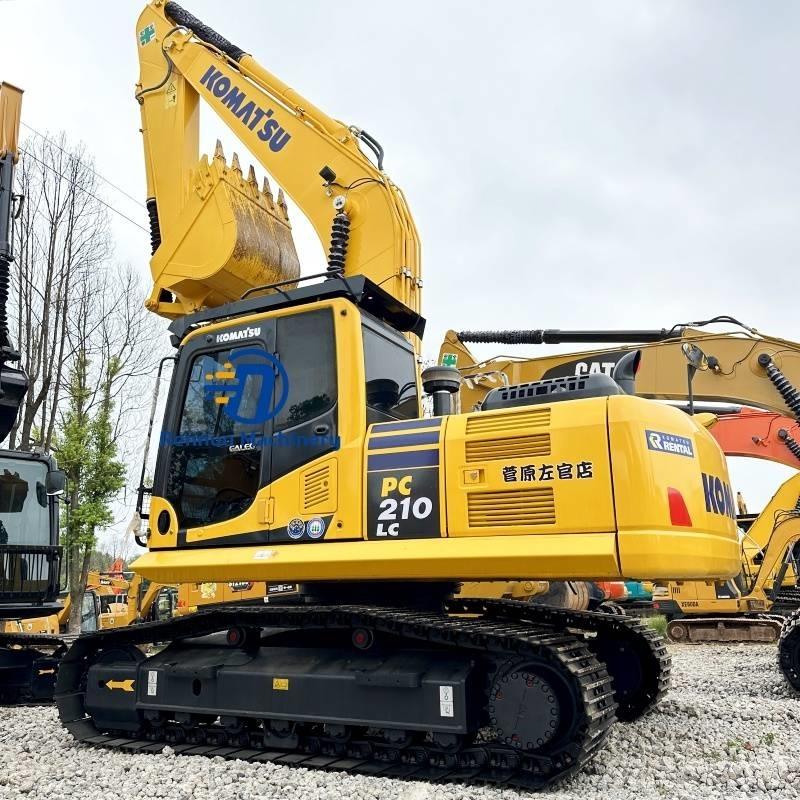 Komatsu PC 210-8 Beltegraver