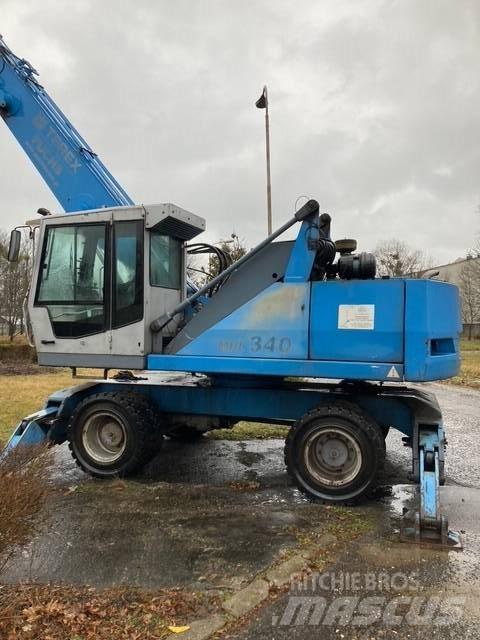 Fuchs 340 Gravemaskiner for avfallshåndtering