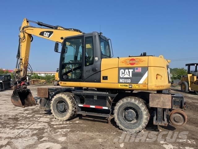 CAT M315D Hjulgravere