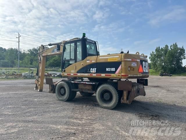 CAT M318D Hjulgravere
