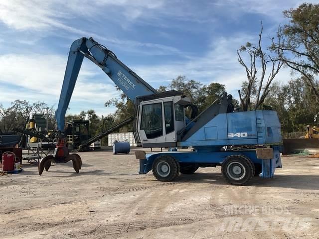 Fuchs MHL340 Gravemaskiner for avfallshåndtering