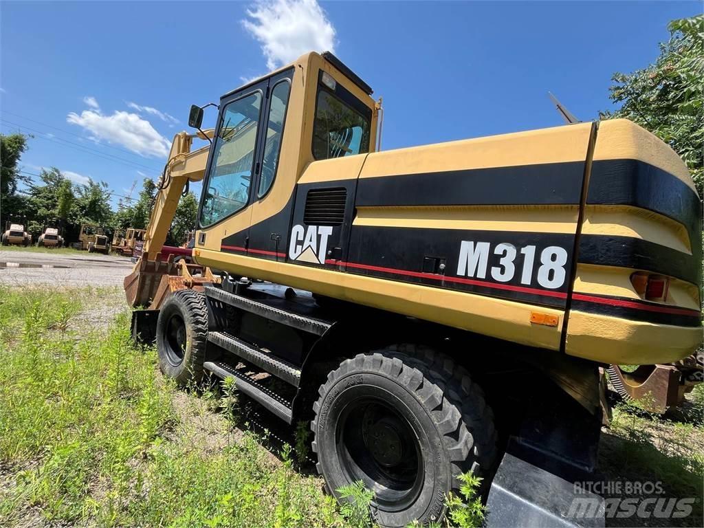 CAT M318 Hjulgravere