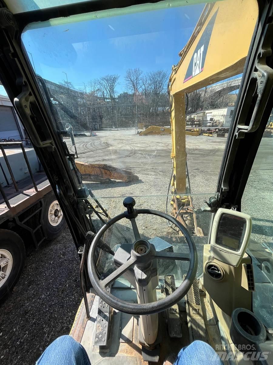 CAT M318C Hjulgravere