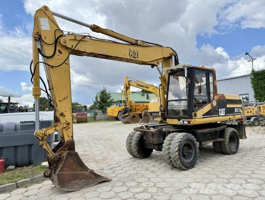 CAT M318 Hjulgravere