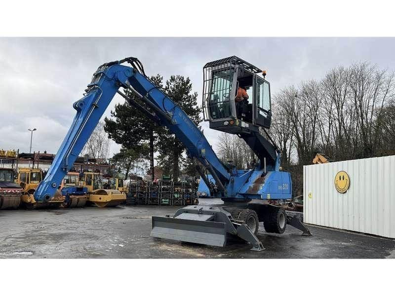 Fuchs MHL320 Gravemaskiner for avfallshåndtering