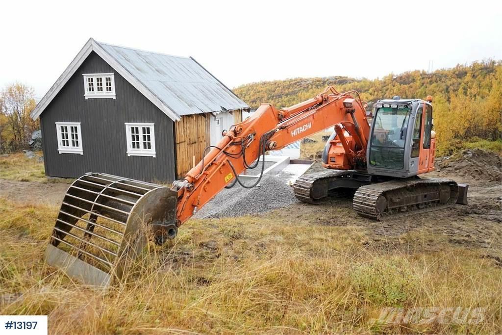 Hitachi ZX135US with blade Beltegraver