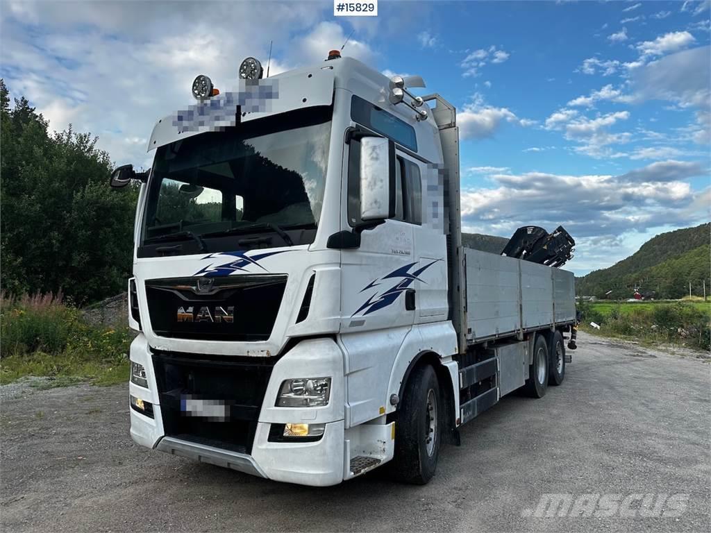 MAN TGX 26.560 Flatbed truck with Hiab 138 crane from  Planbiler
